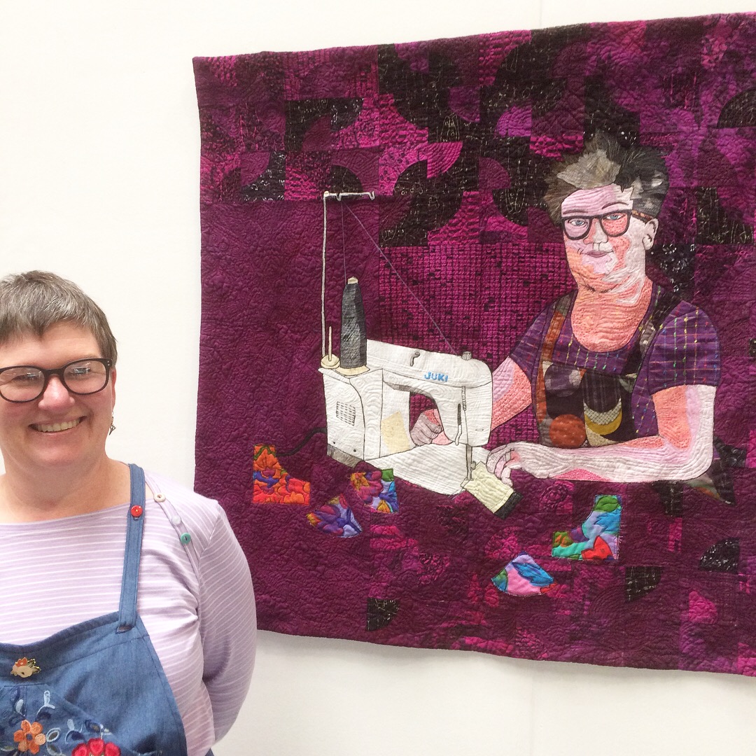 Rhonda Hazell with her portrait quilt at the FOQ 2018