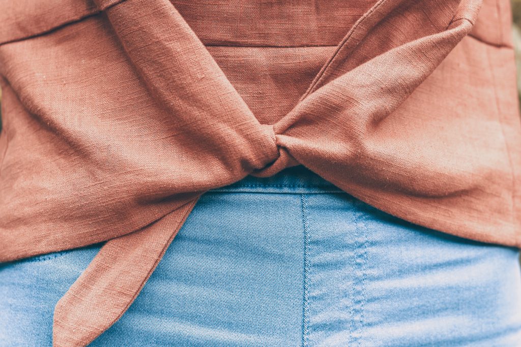 brown linen Jily top with waist tie with blue skinny jeans