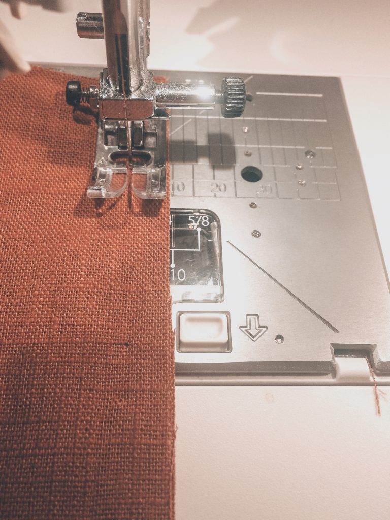 Juki sewing machine needle with brown orange linen