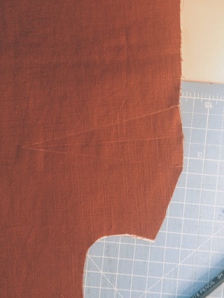 orange brown linen garment piece with dart marked in chalk