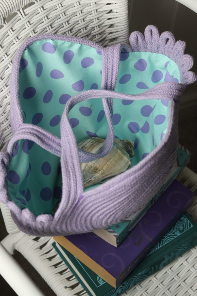 lined rope bag on books