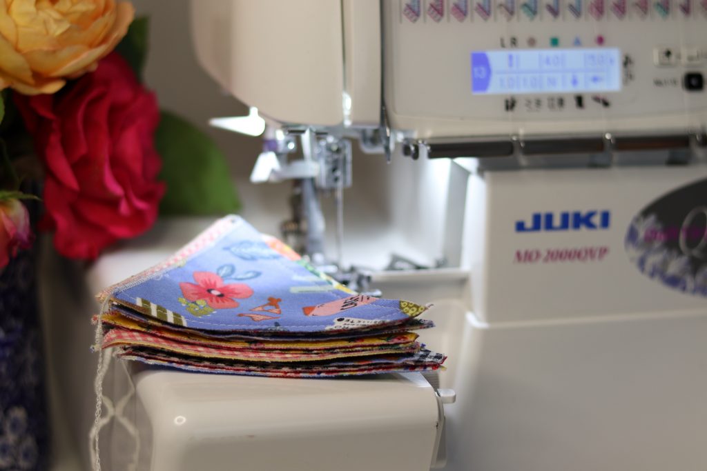 Juki MO-2000 overlocker with baby bunting flags